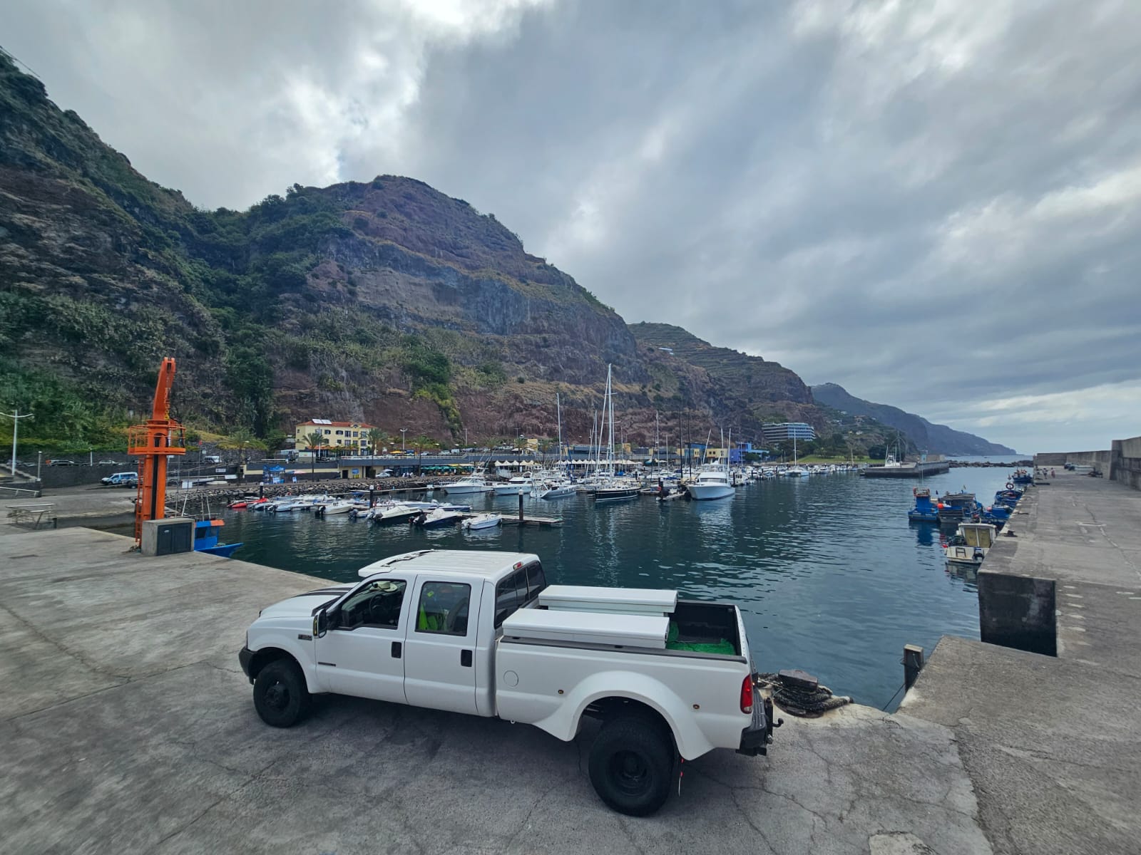 Pedro's maintenance truck beside a marina in Madeira